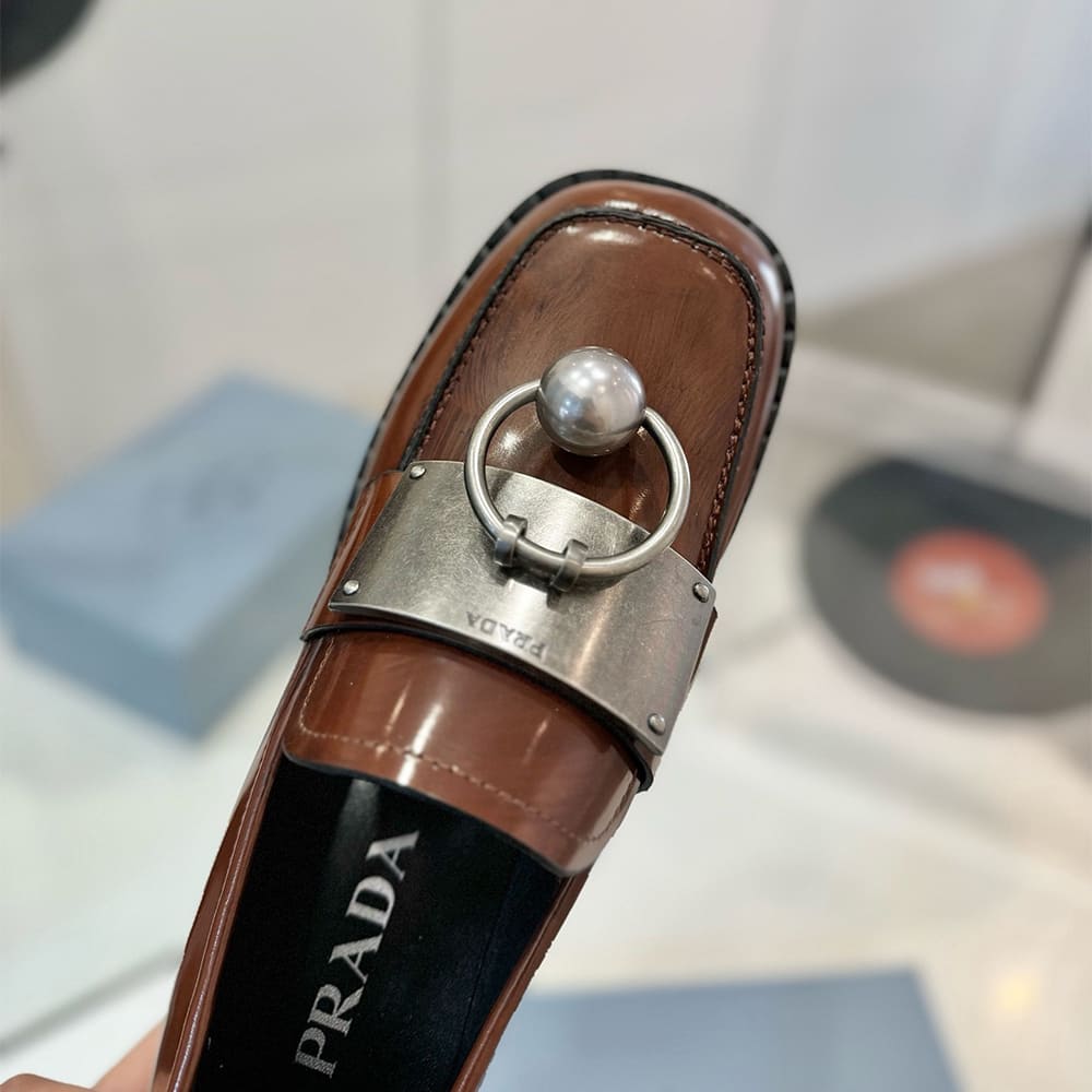 Pra*a Brushed leather loafers with metal details