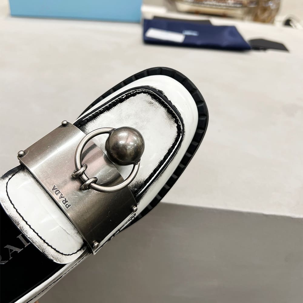 Pra*a Brushed leather loafers with metal details