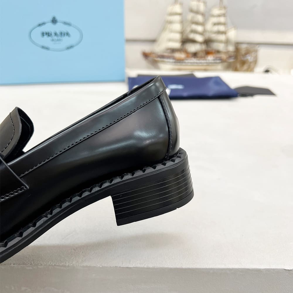 Pra*a Brushed leather loafers with metal details