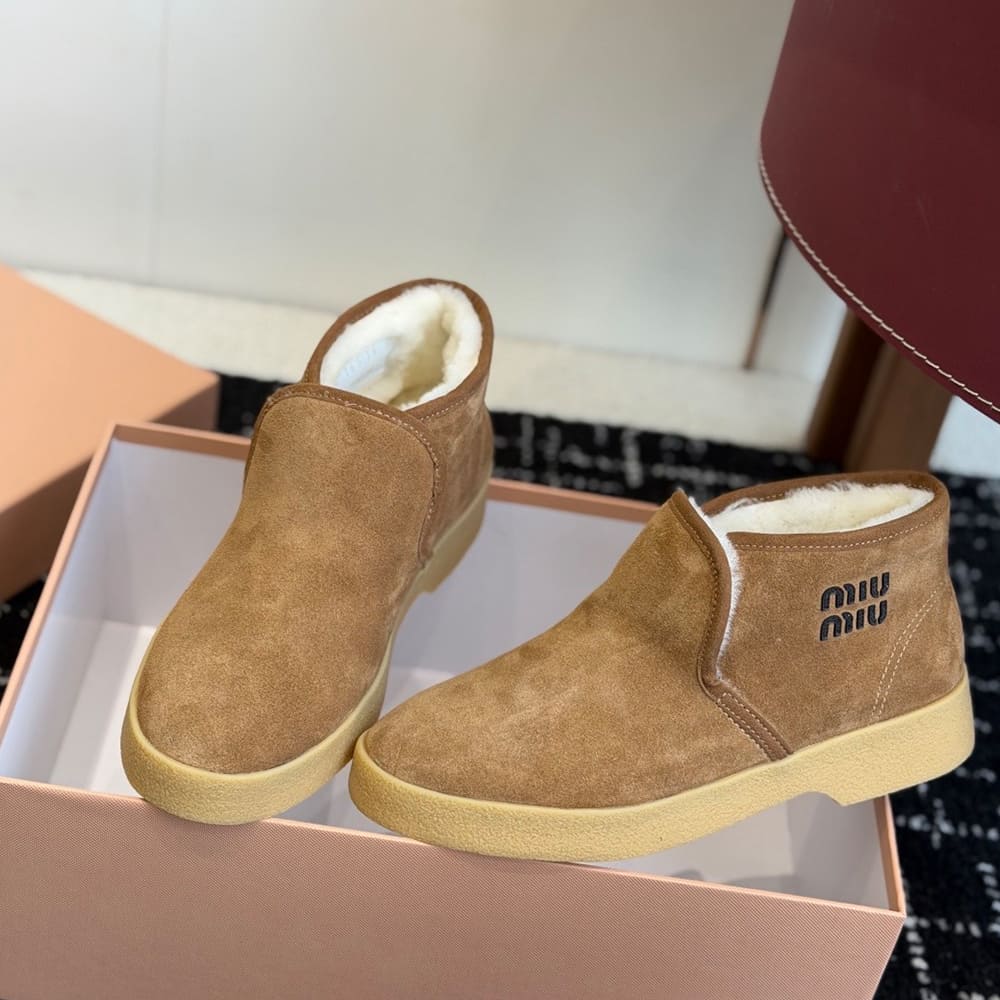 M1um1u Suede and shearling slip-on booties