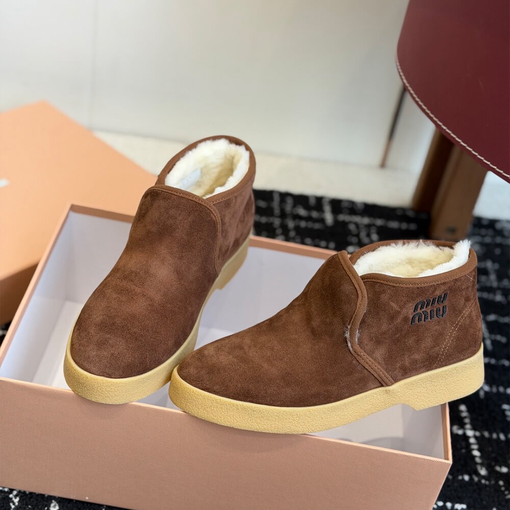 M1um1u Suede and shearling slip-on booties