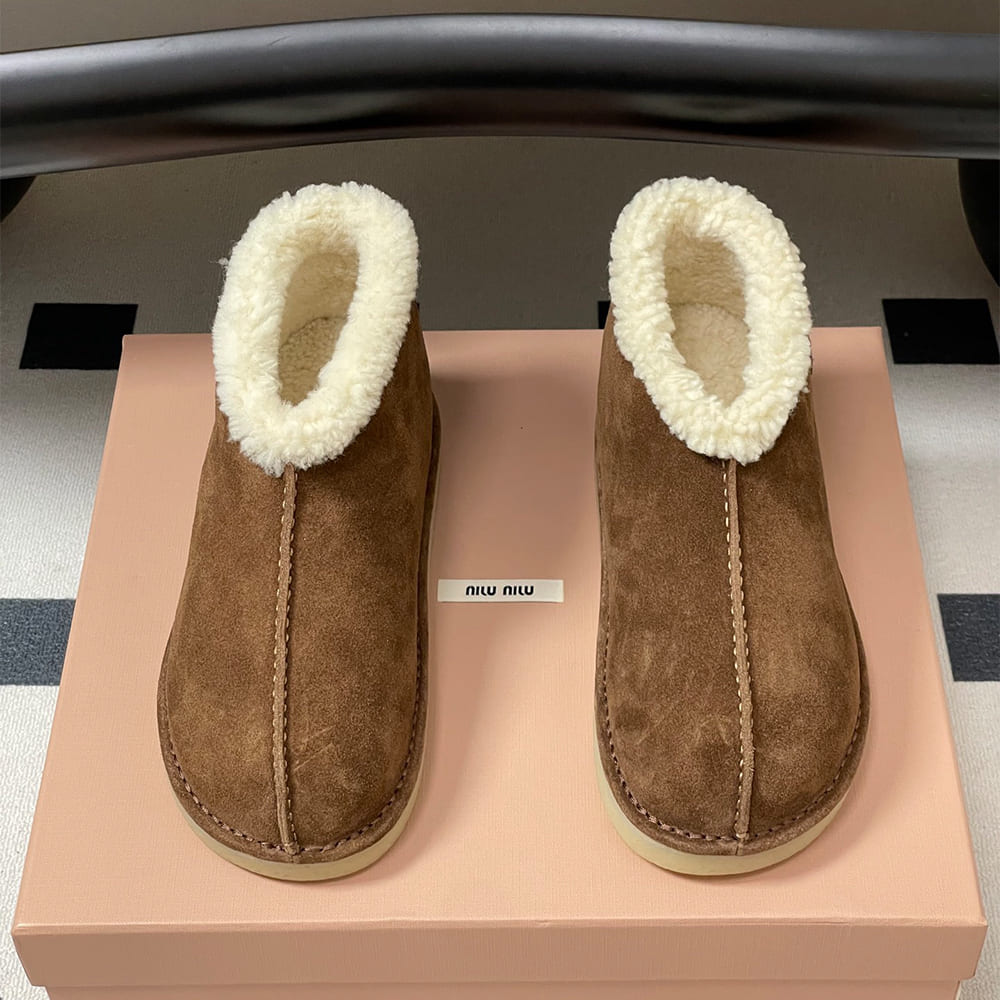 M1um1u Suede and shearling slip-on booties