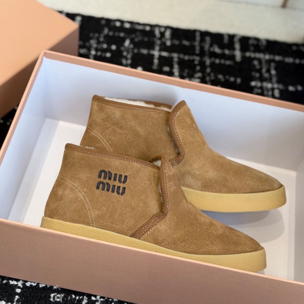 M1um1u Suede and shearling slip-on booties