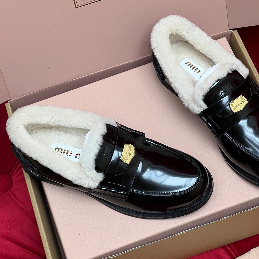 M1um1u Bleached leather and shearling penny loafers
