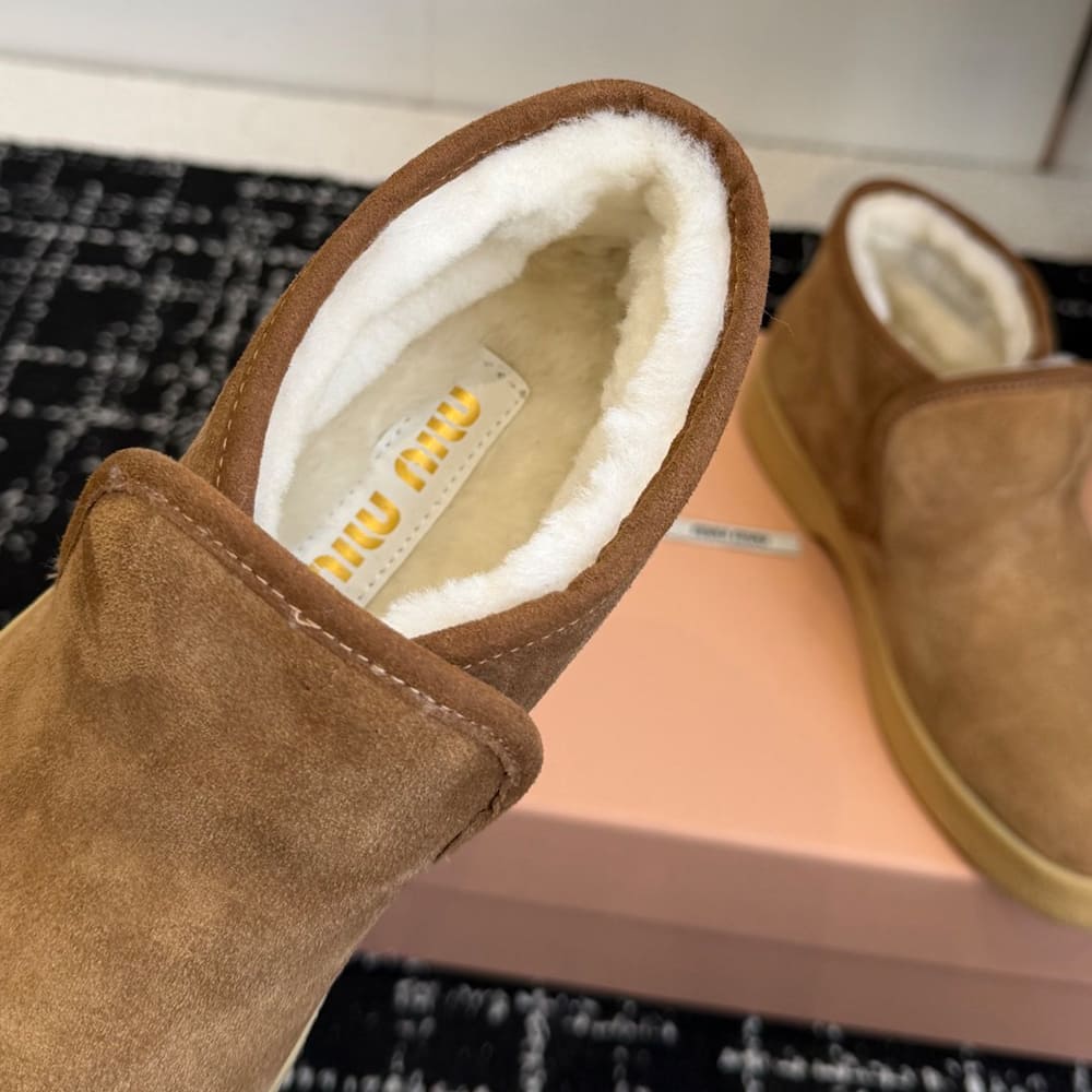 M1um1u Suede and shearling slip-on booties